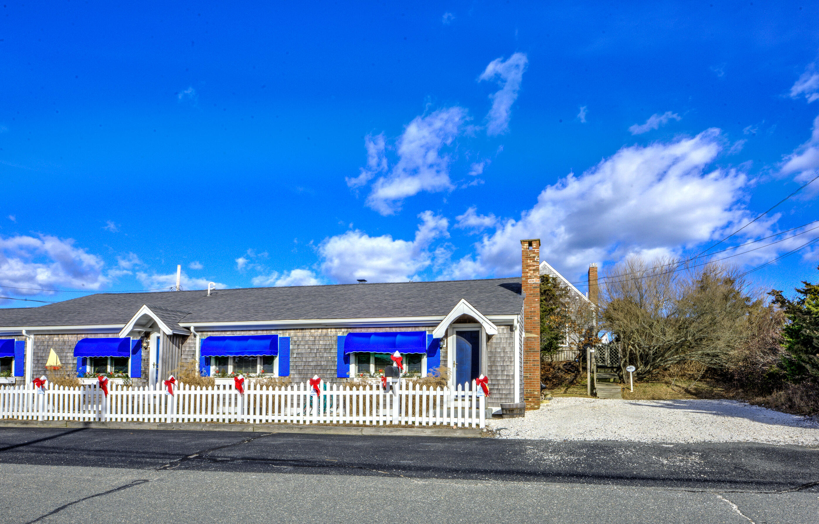 131 North Shore Boulevard, Unit 2A East Sandwich, MA 02537 - Photo 2 of 13 a view of a building with a street