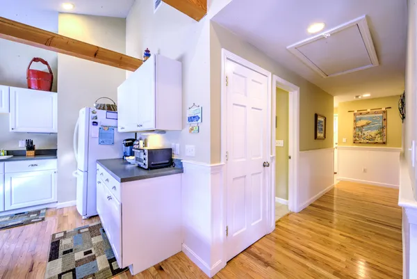 a kitchen with granite countertop a stove and a refrigerator