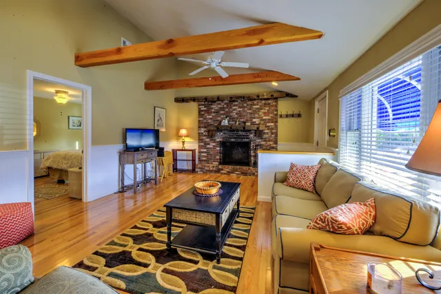 a outdoor living space with furniture and a fireplace