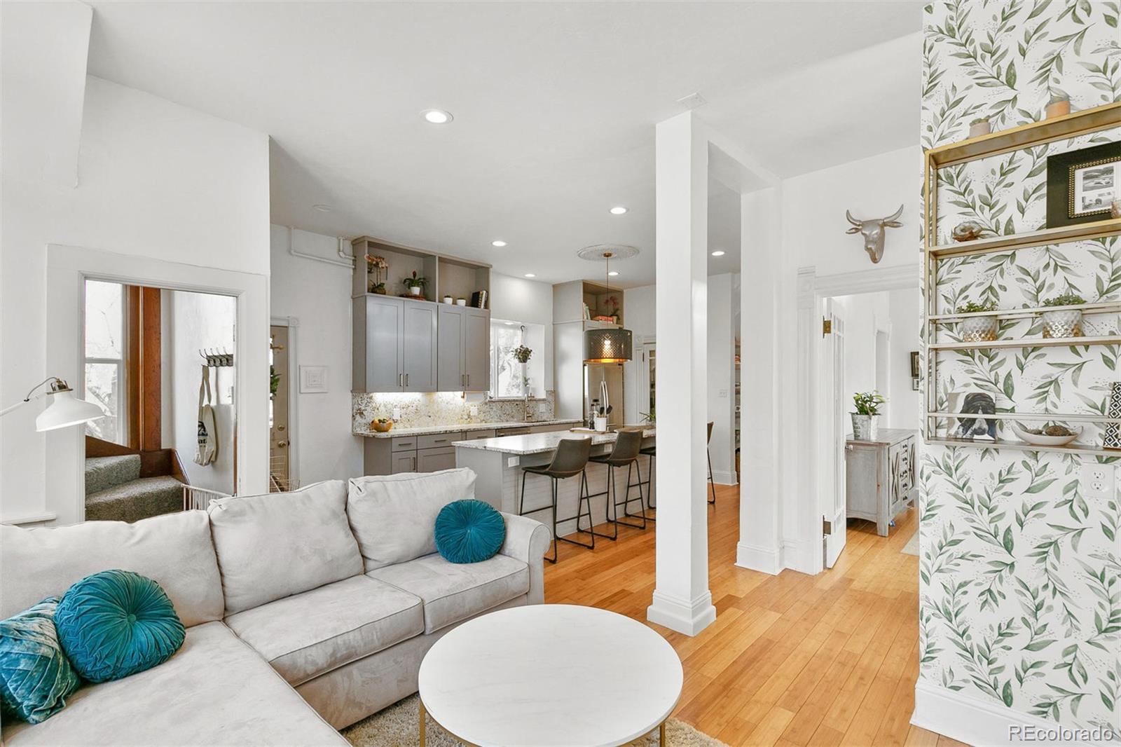 5127 Lowell Boulevard Denver, CO 80221 - Photo 13 of 39 a living room with furniture and a wooden floor