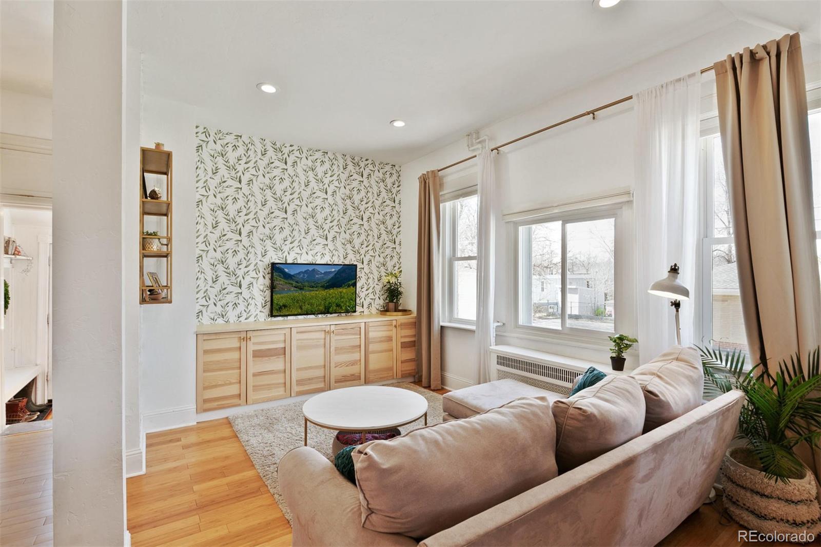 5127 Lowell Boulevard Denver, CO 80221 - Photo 15 of 39 a living room with furniture and a flat screen tv