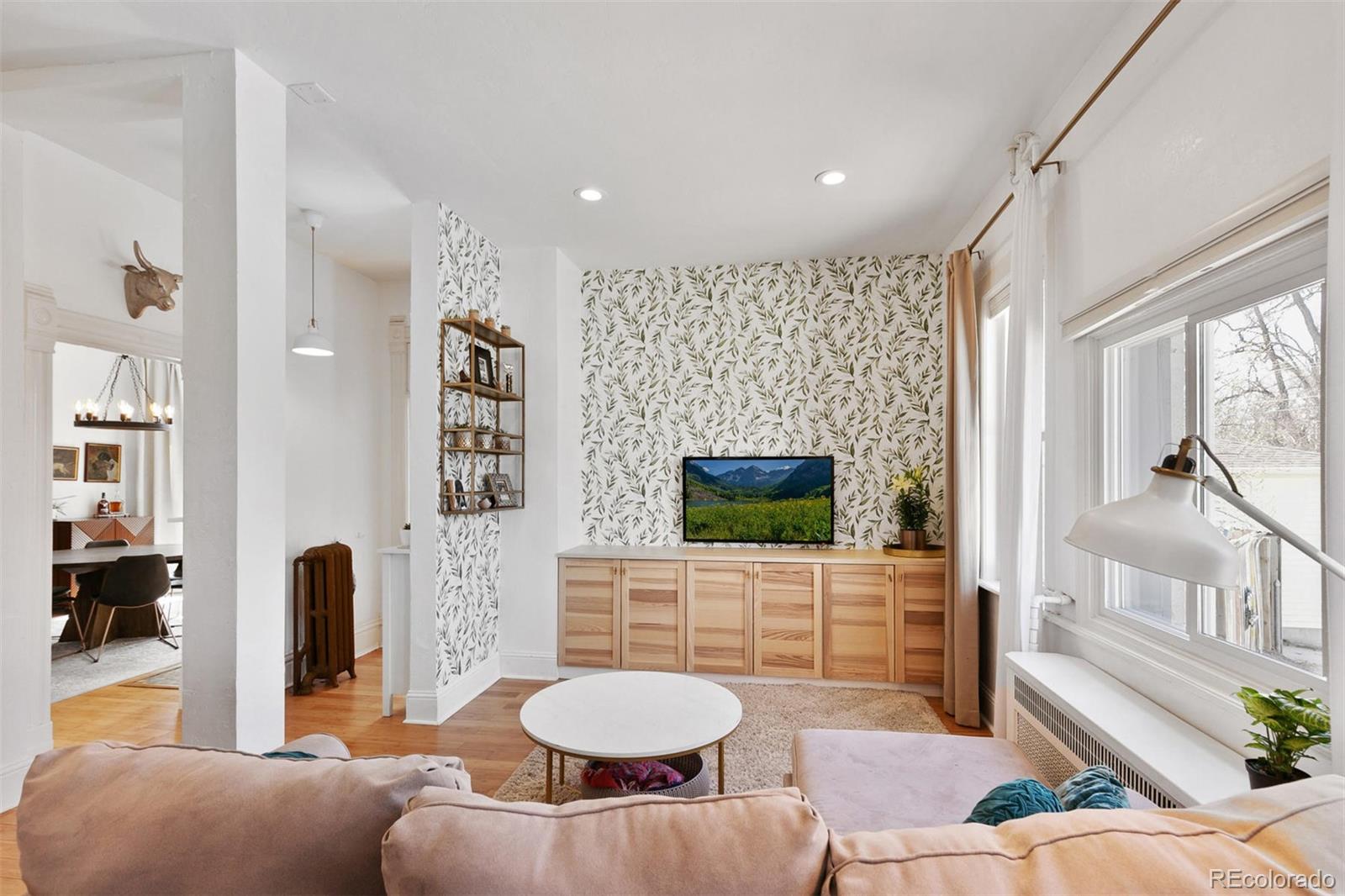 5127 Lowell Boulevard Denver, CO 80221 - Photo 16 of 39 a living room with furniture and a flat screen tv