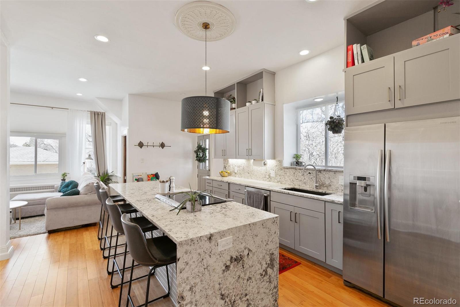 5127 Lowell Boulevard Denver, CO 80221 - Photo 20 of 39 a kitchen with sink cabinets and stainless steel appliances