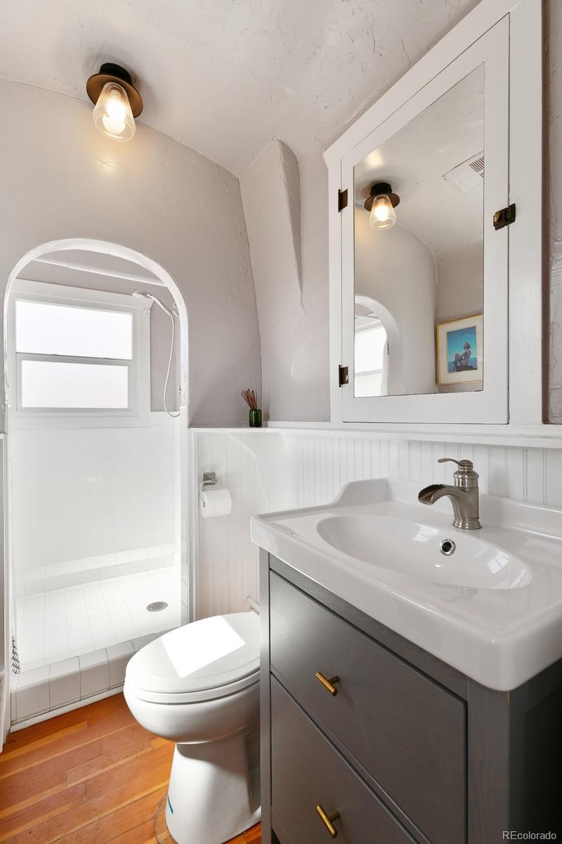 5127 Lowell Boulevard Denver, CO 80221 - Photo 22 of 39 a bathroom with a sink and a mirror