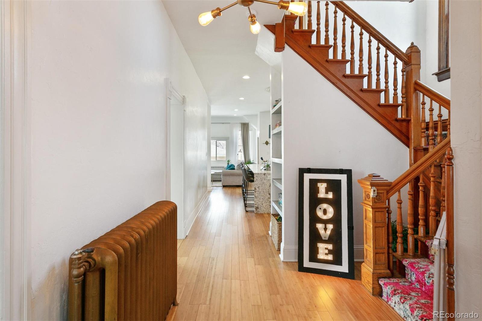 5127 Lowell Boulevard Denver, CO 80221 - Photo 23 of 39 a view of entryway and hall with wooden floor