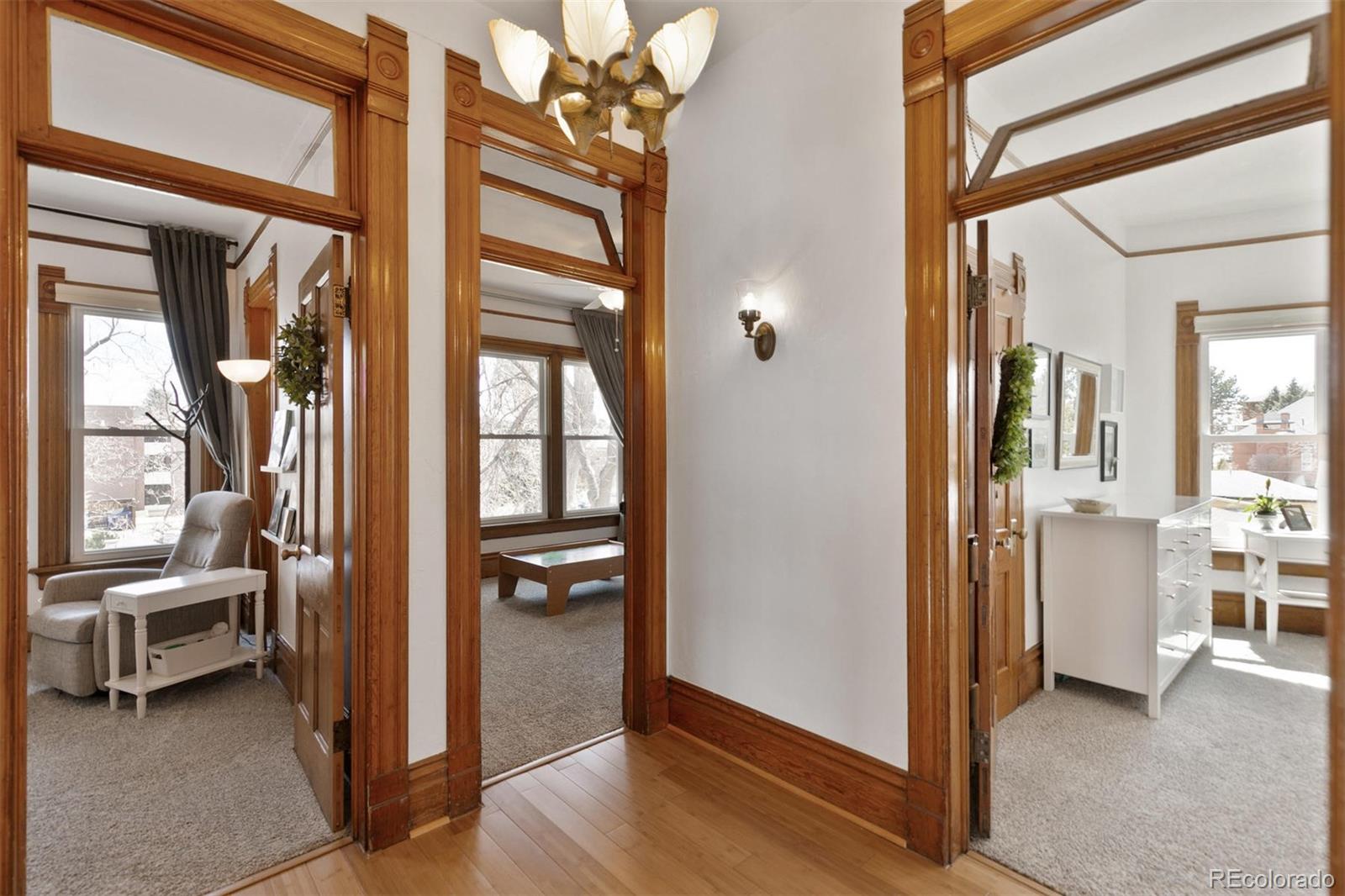 5127 Lowell Boulevard Denver, CO 80221 - Photo 25 of 39 a view of a hallway and a livingroom with furniture