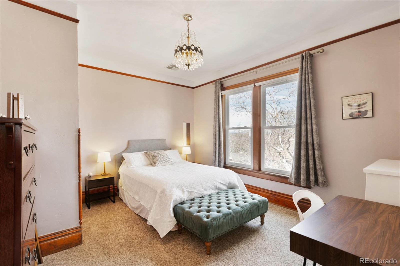 5127 Lowell Boulevard Denver, CO 80221 - Photo 28 of 39 a bedroom with a bed and a table in it