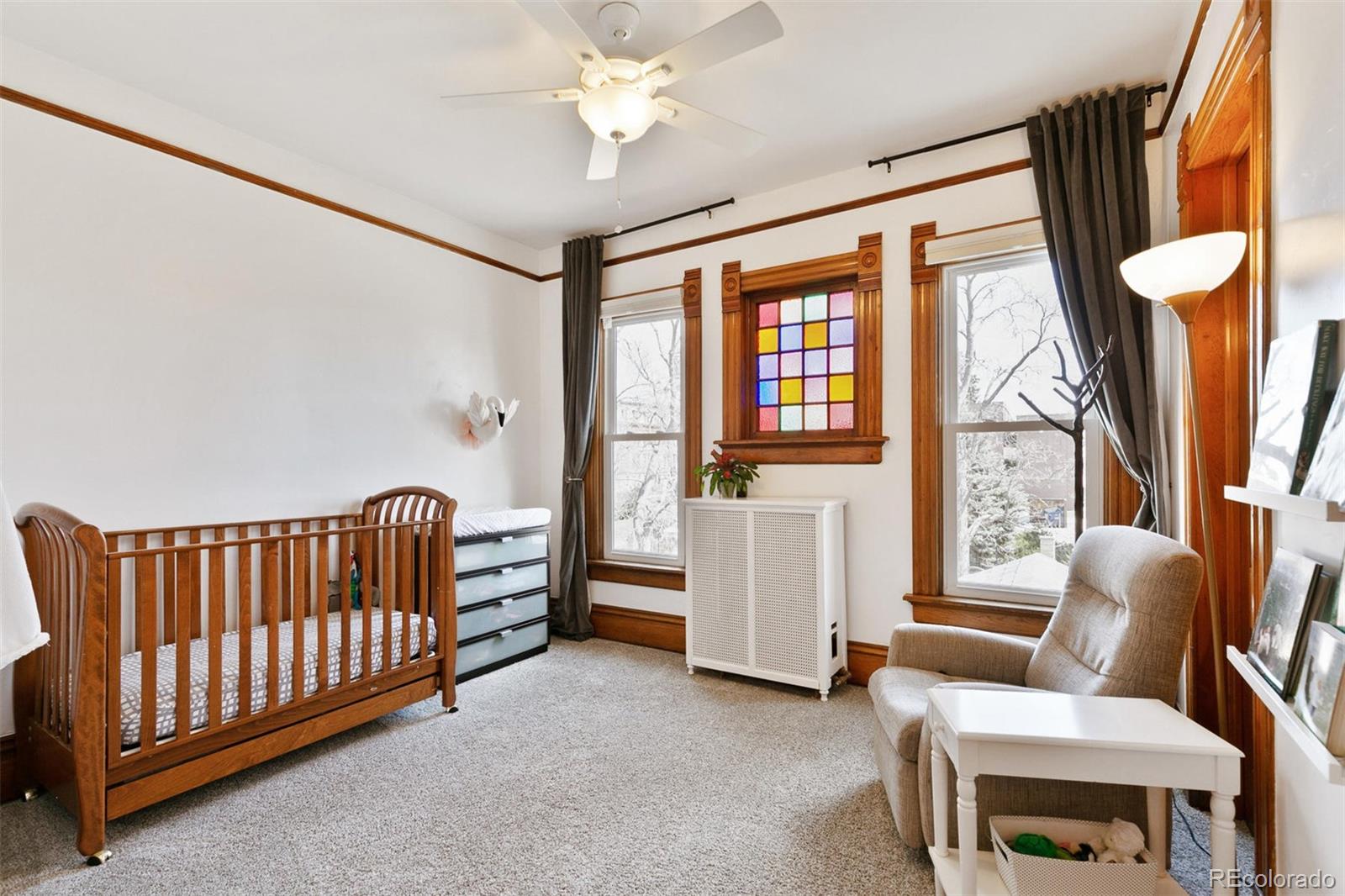 5127 Lowell Boulevard Denver, CO 80221 - Photo 29 of 39 a living room with furniture and a window