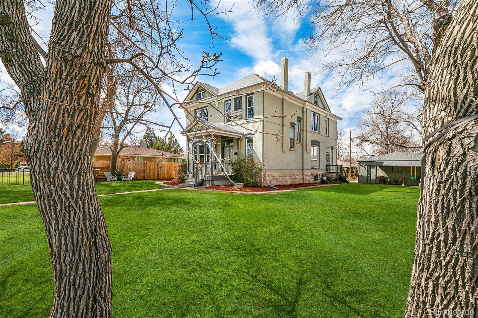 5127 Lowell Boulevard Denver, CO 80221 - Photo 3 of 39 a view of a house with backyard sitting area and garden
