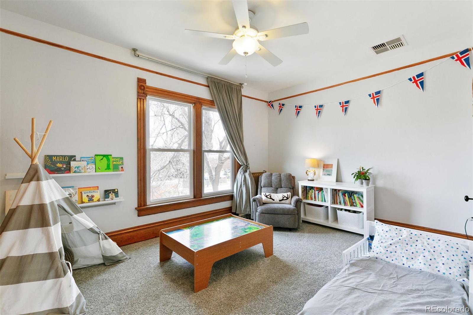 5127 Lowell Boulevard Denver, CO 80221 - Photo 31 of 39 a living room with furniture and a window
