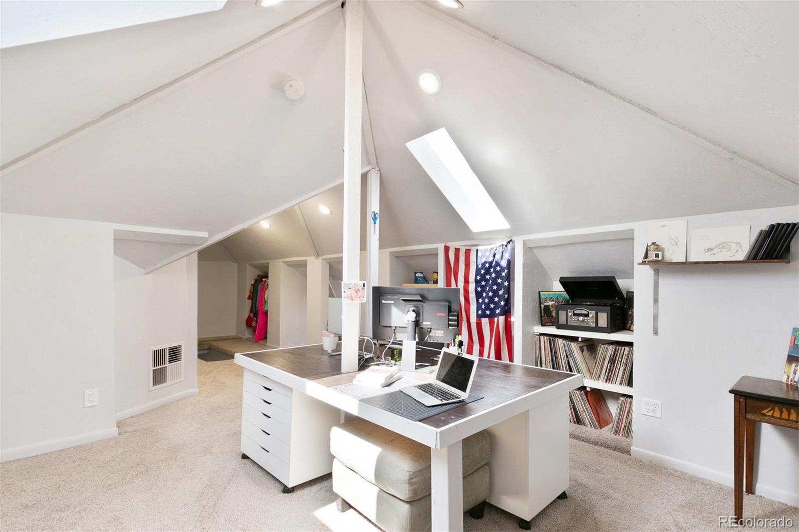 5127 Lowell Boulevard Denver, CO 80221 - Photo 33 of 39 a kitchen that has a lot of cabinets and wooden floor