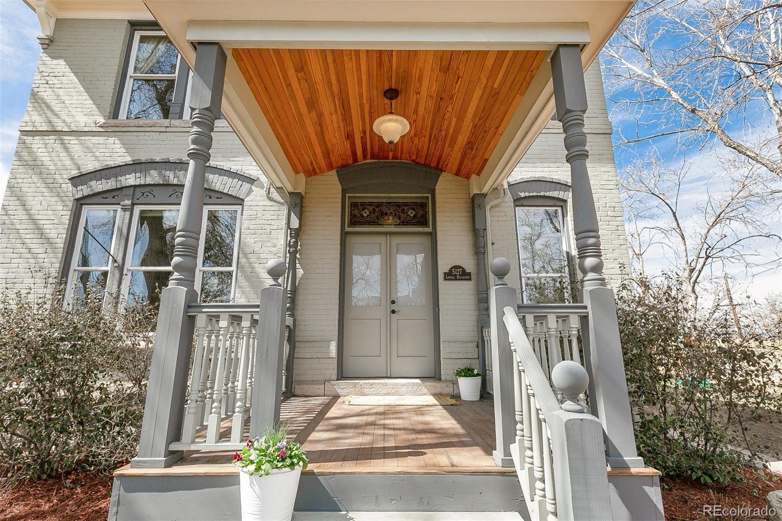 5127 Lowell Boulevard Denver, CO 80221 - Photo 8 of 39 a front view of a house with a outdoor space
