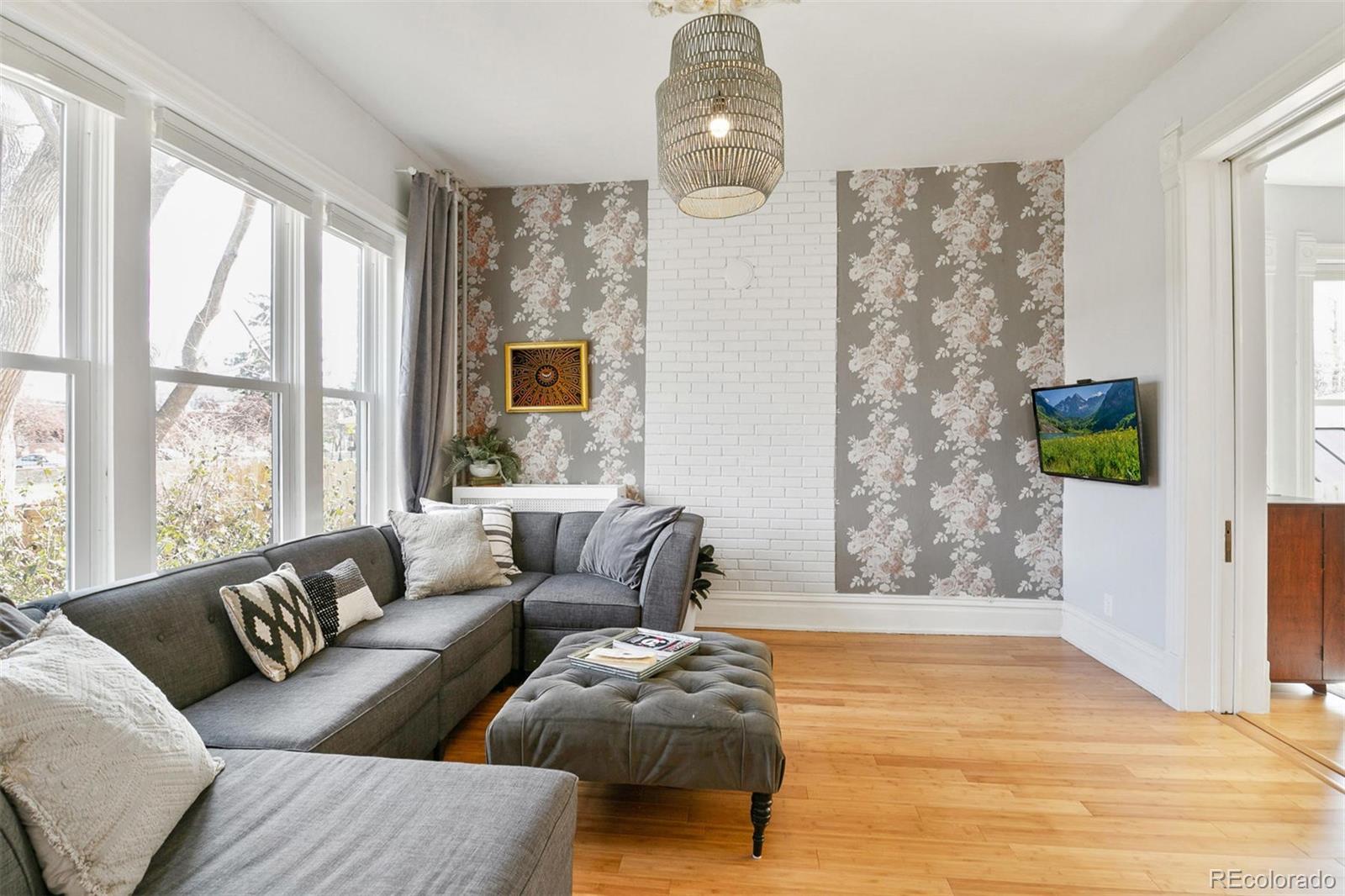 5127 Lowell Boulevard Denver, CO 80221 - Photo 10 of 39 a living room with furniture and a window