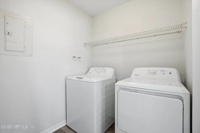 wooden floor in a hall with an empty room