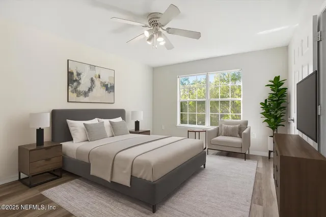 a bathroom with double vanity sinks and a mirror
