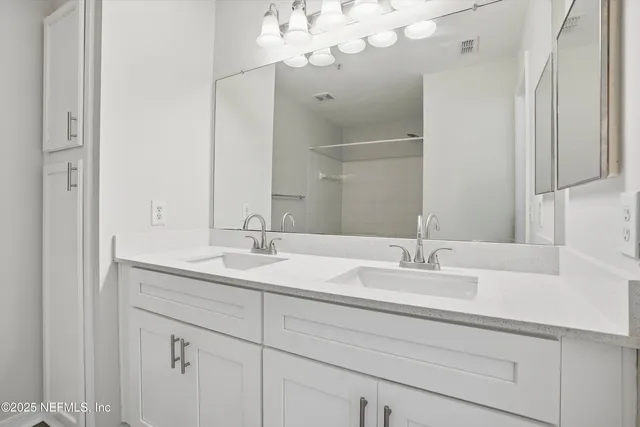 a bed room with a bed and a large window