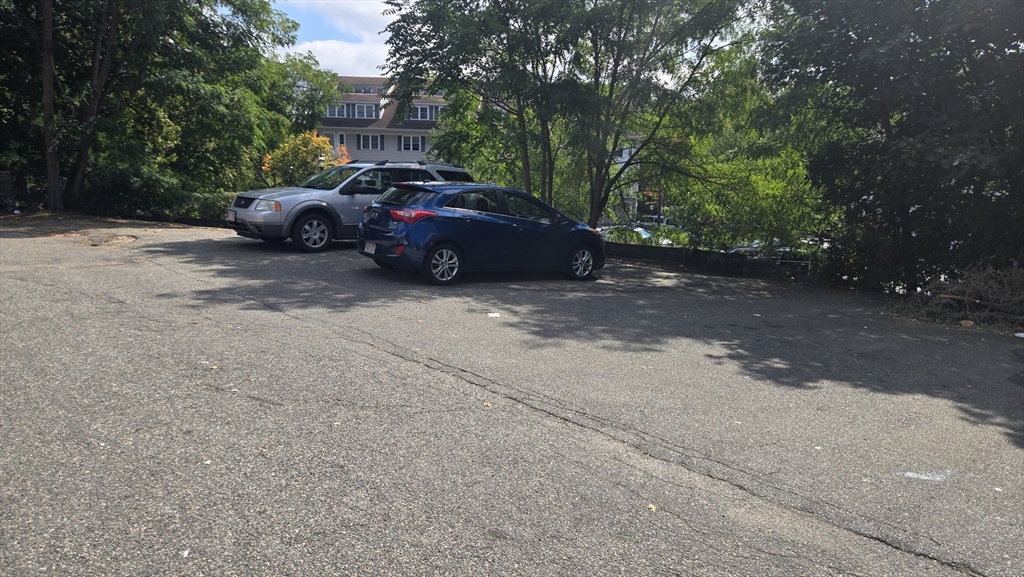 651 Washington Street Canton, MA 02021 - Photo 13 of 13 a front view of a house with cars parked on road