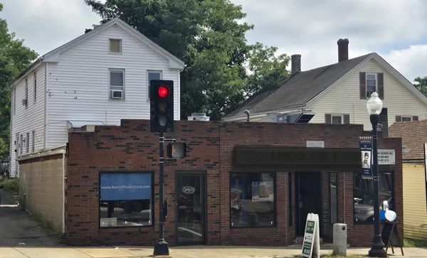 a front view of a house with barbeque