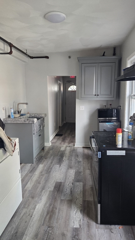 651 Washington Street Canton, MA 02021 - Photo 6 of 13 a kitchen with granite countertop a refrigerator stove and sink