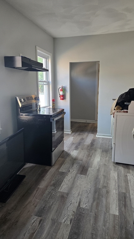 651 Washington Street Canton, MA 02021 - Photo 8 of 13 a kitchen with granite countertop a refrigerator and a stove