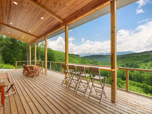 a view of a balcony with couch and wooden floor