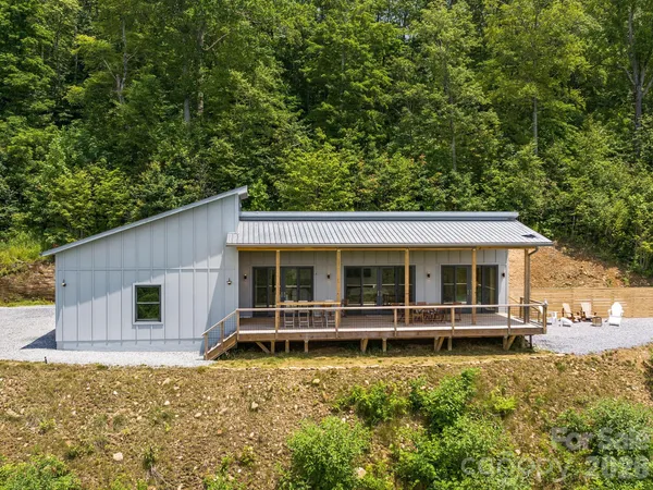 a view of a house with a yard and garage