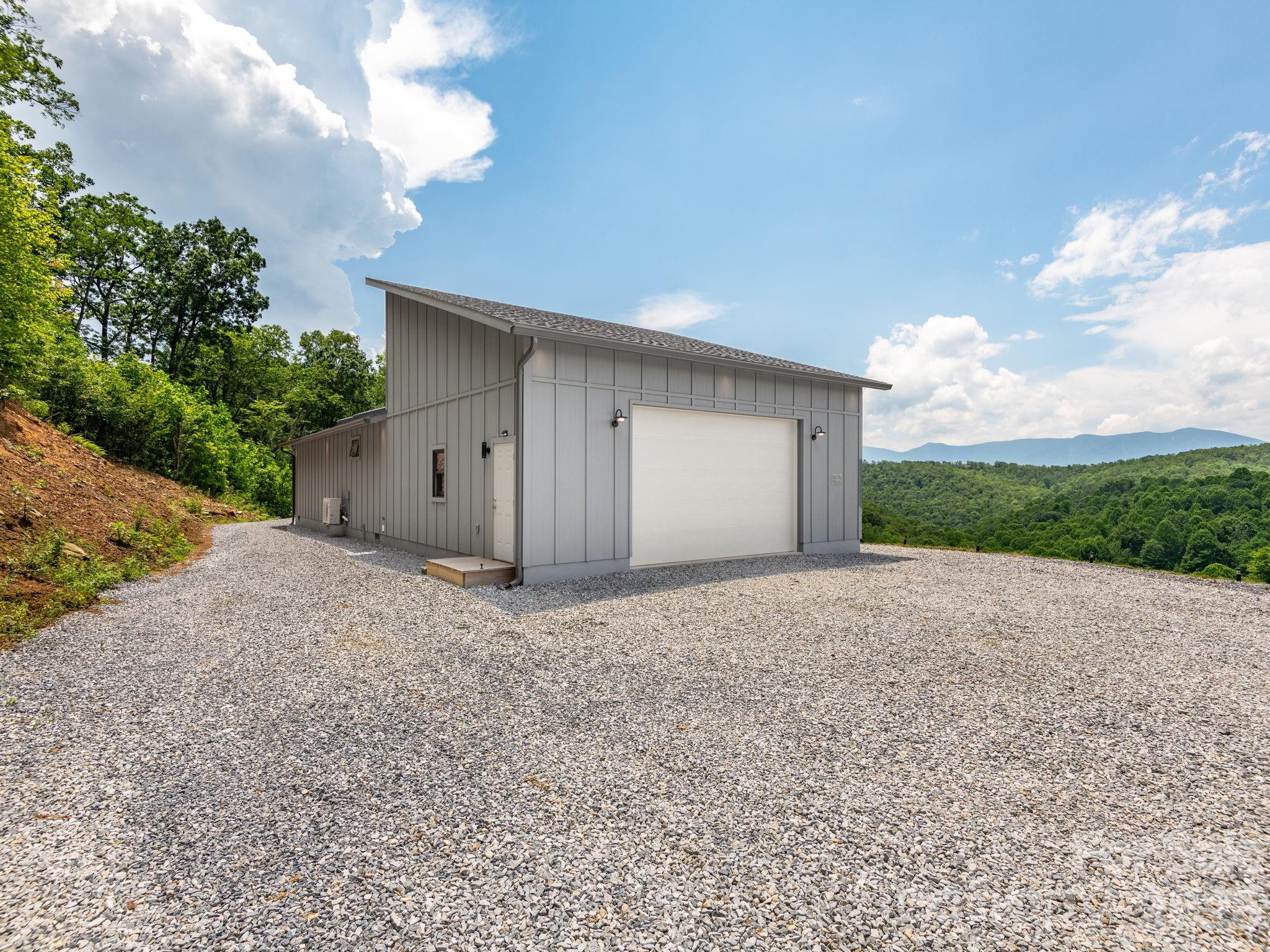 511 Emerald Mine Road Spruce Pine, NC 28777 - Photo 20 of 23 a view of a house with a yard and garage