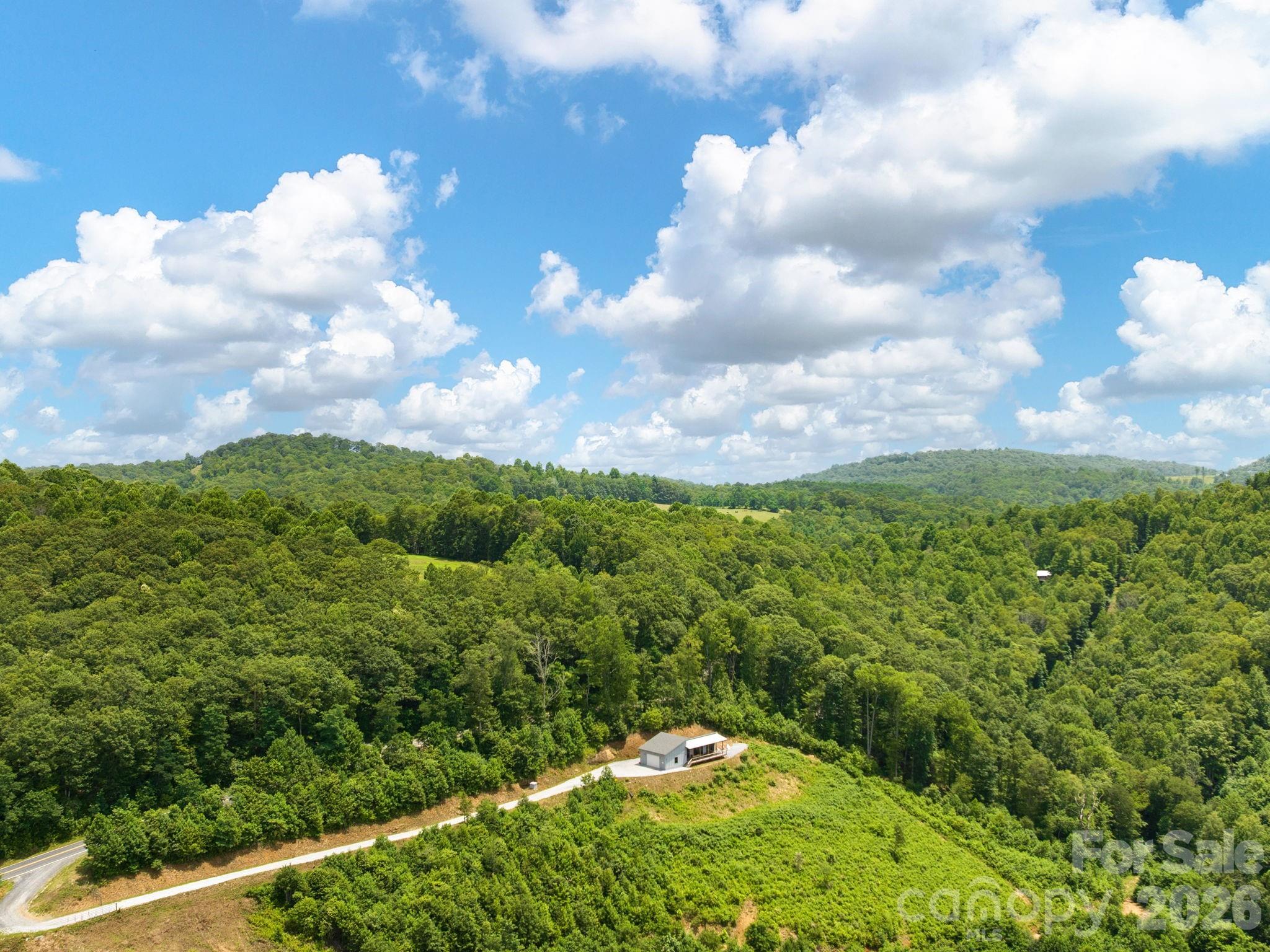 511 Emerald Mine Road Spruce Pine, NC 28777 - Photo 22 of 23 a view of a green field