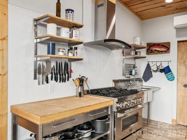 a kitchen with stove and cabinets
