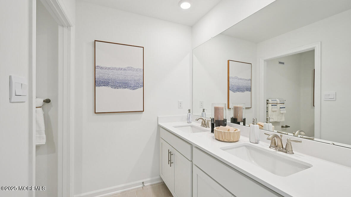 60 Penny Lane Neptune Township, NJ 07753 - Photo 31 of 37 a bathroom with 2 sink and a mirror