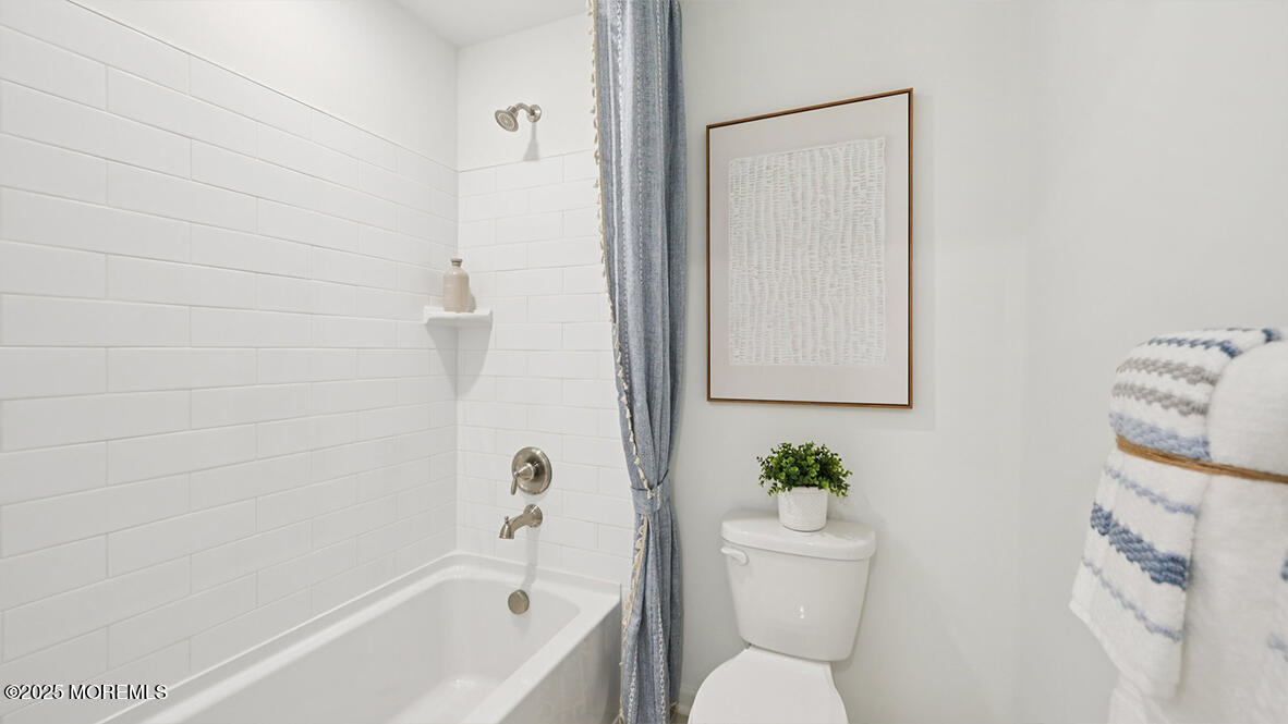 60 Penny Lane Neptune Township, NJ 07753 - Photo 32 of 37 a white bath tub sitting next to a white toilet