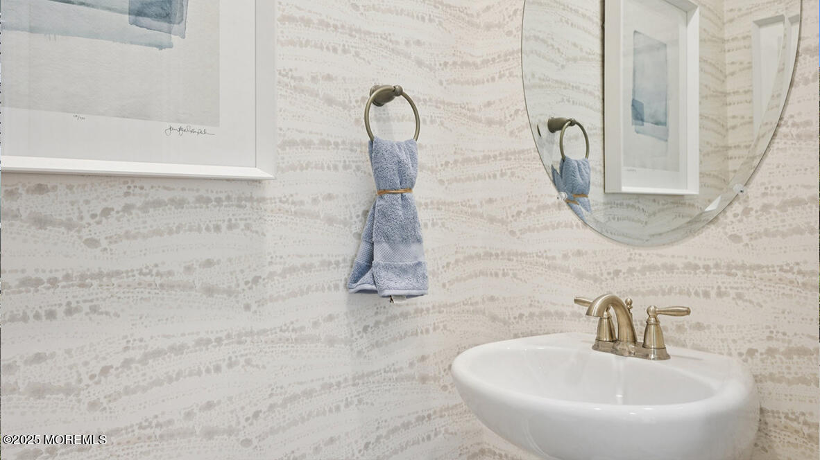 60 Penny Lane Neptune Township, NJ 07753 - Photo 5 of 37 a bathroom with a sink and a mirror