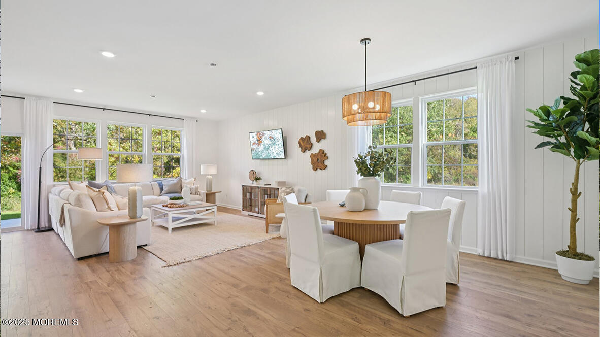 60 Penny Lane Neptune Township, NJ 07753 - Photo 10 of 37 a living room with furniture and a potted plant