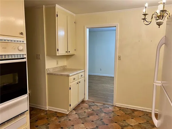 a white refrigerator freezer sitting inside of a kitchen