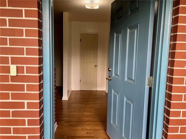 a view of a brick house with a door