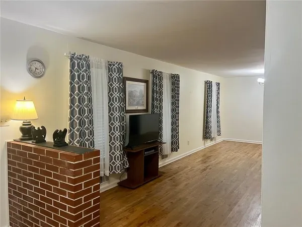 a view of an empty room with a fireplace