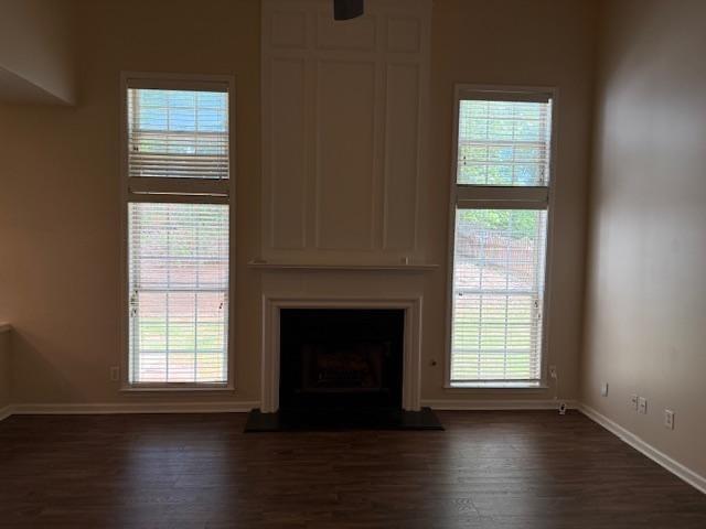 4168 Glenaire Way Northwest Acworth, GA 30101 - Photo 4 of 19 an empty room with wooden floor fireplace and windows