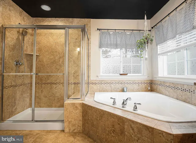 a bath tub sitting next to a window