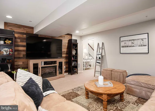 a living room with fireplace furniture and a flat screen tv