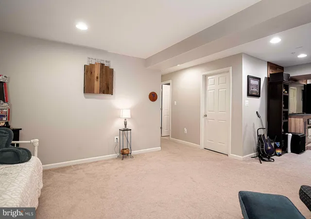 a view of a livingroom with workspace and a couch