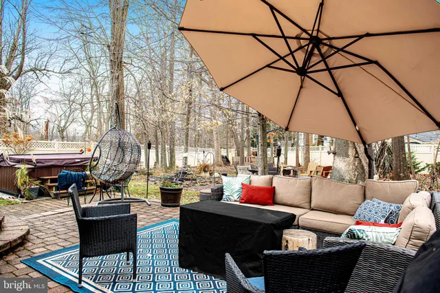 a living room with furniture and a umbrella