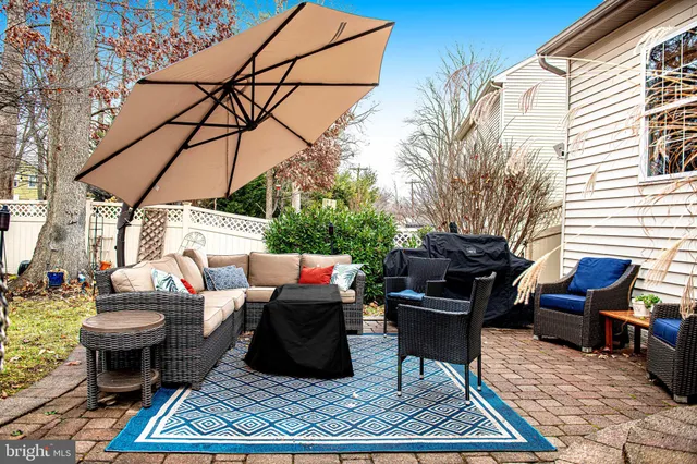 a outdoor space with the couches and a table