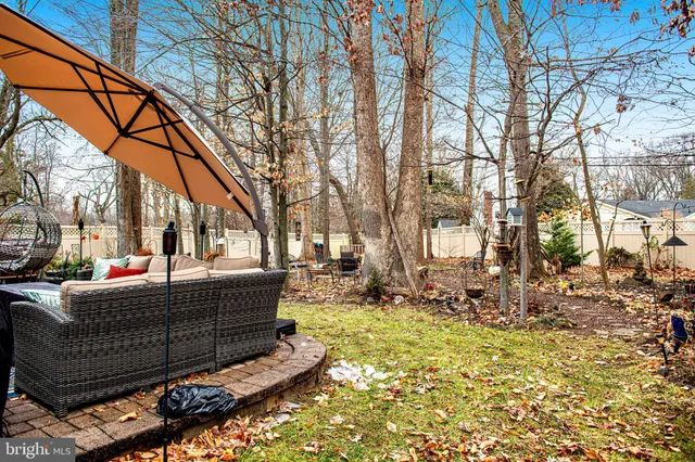 a view of a patio with chairs and a table