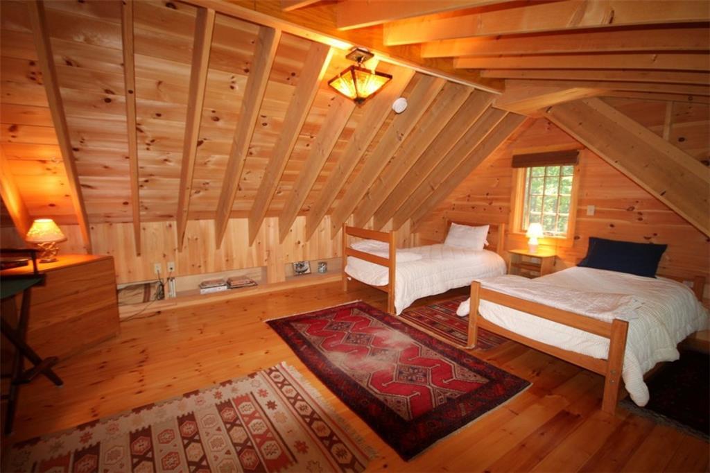 232 Dogfish Head Road Southport, ME 04576 - Photo 33 of 35 Guest house loft with oak flooring