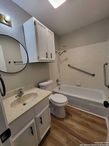 a bathroom with a sink a toilet and bathtub