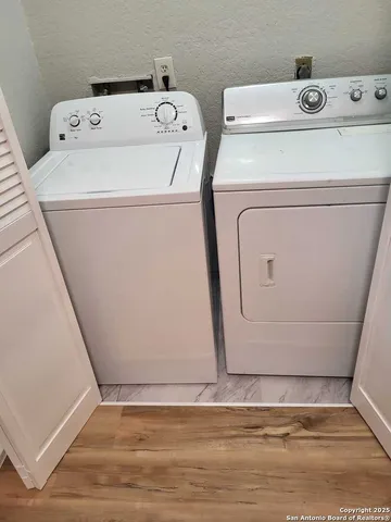 a utility room with dryer and washer