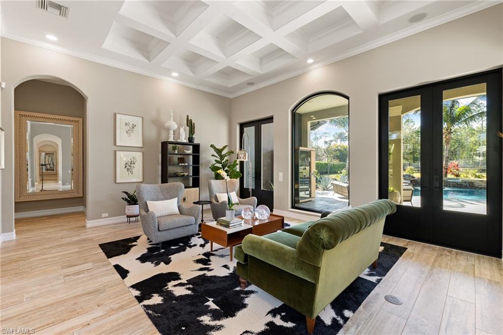 6610 Sable Ridge Lane Naples, FL 34109 - Photo 14 of 47 a living room with furniture and a large window