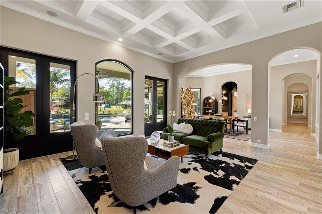 6610 Sable Ridge Lane Naples, FL 34109 - Photo 15 of 47 a living room with furniture fireplace and wooden floor