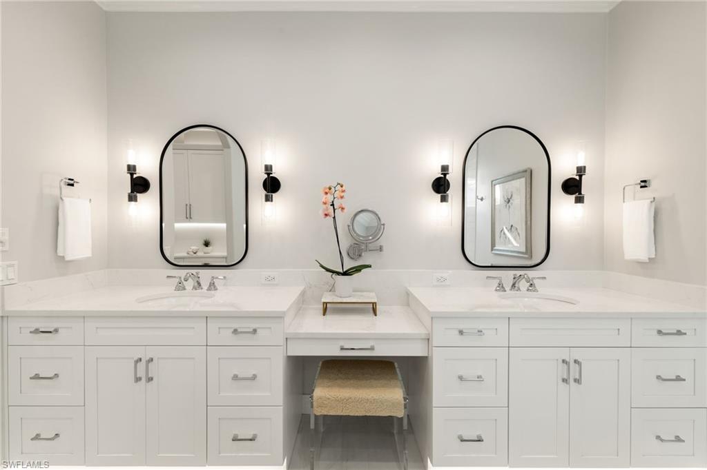 6610 Sable Ridge Lane Naples, FL 34109 - Photo 20 of 47 a bathroom with double vanity sinks and a mirror