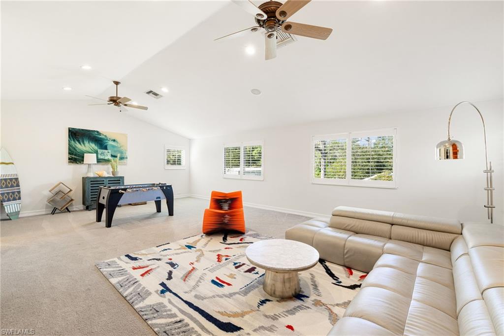 6610 Sable Ridge Lane Naples, FL 34109 - Photo 27 of 47 a living room with furniture and wooden floor